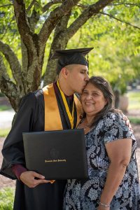graduate kissing his mom
