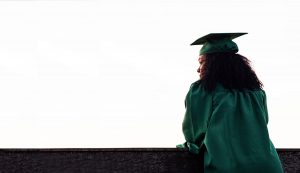 girl in green cap and gown