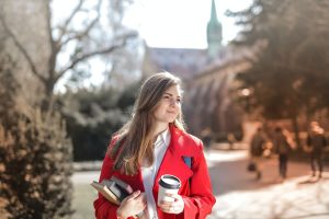 student in red coat